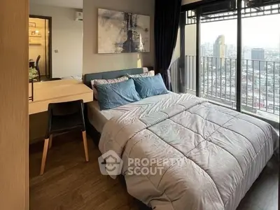Modern bedroom with city view and stylish decor in high-rise apartment