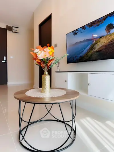 Modern living room with stylish decor and wall-mounted TV