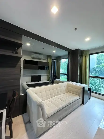 Modern living room with stylish sofa and large window view