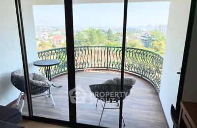 Stunning balcony with panoramic city view and cozy seating area