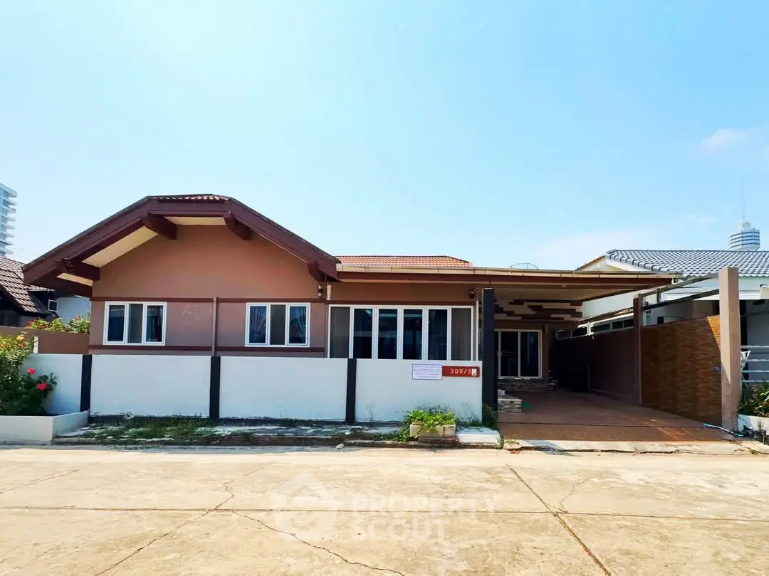 Charming single-story house with spacious driveway and modern design in a serene neighborhood.