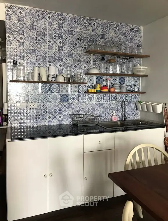 Charming kitchen with patterned tile backsplash and open shelving