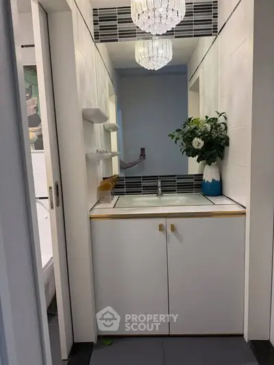 Modern bathroom with elegant lighting and stylish cabinetry