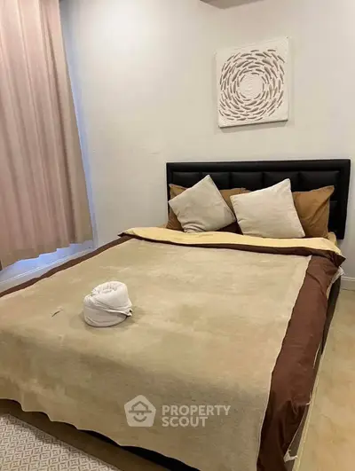 Cozy bedroom with stylish decor and comfortable bedding in modern apartment.