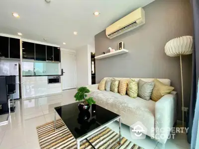 Modern living room with sleek decor, air conditioning, and stylish furniture in a bright apartment.