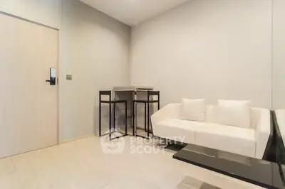 Modern living room with minimalist decor and cozy seating area