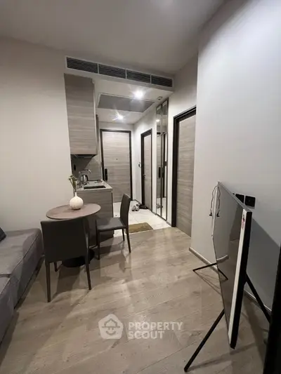 Modern compact apartment with open layout and stylish furnishings