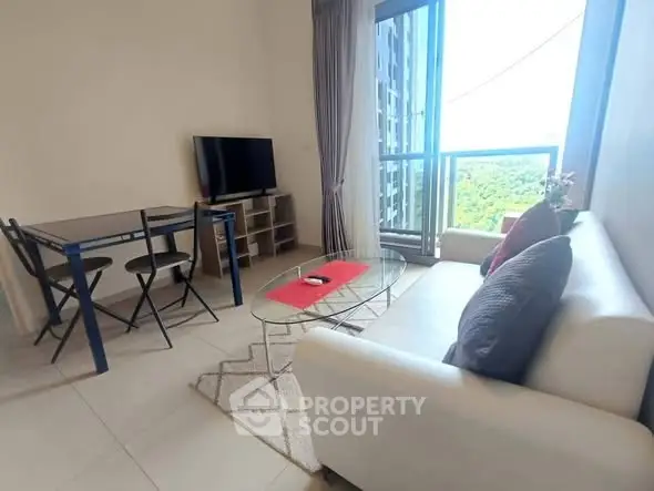 Modern living room with balcony view in high-rise apartment