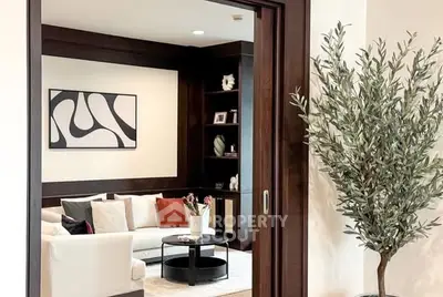 Elegant living room with modern art and cozy seating area