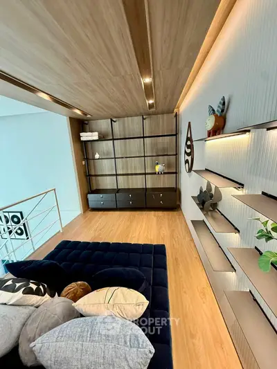 Modern living room with stylish shelving and cozy seating area