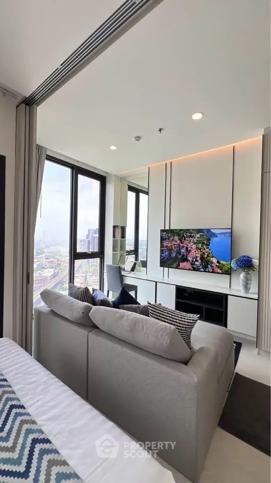Modern living room with panoramic city view and stylish decor