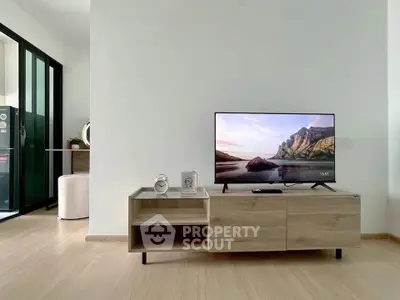 Modern living room with sleek TV stand and minimalist decor, perfect for contemporary urban living.