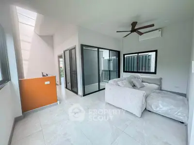 Modern living room with large windows and cozy sectional sofa