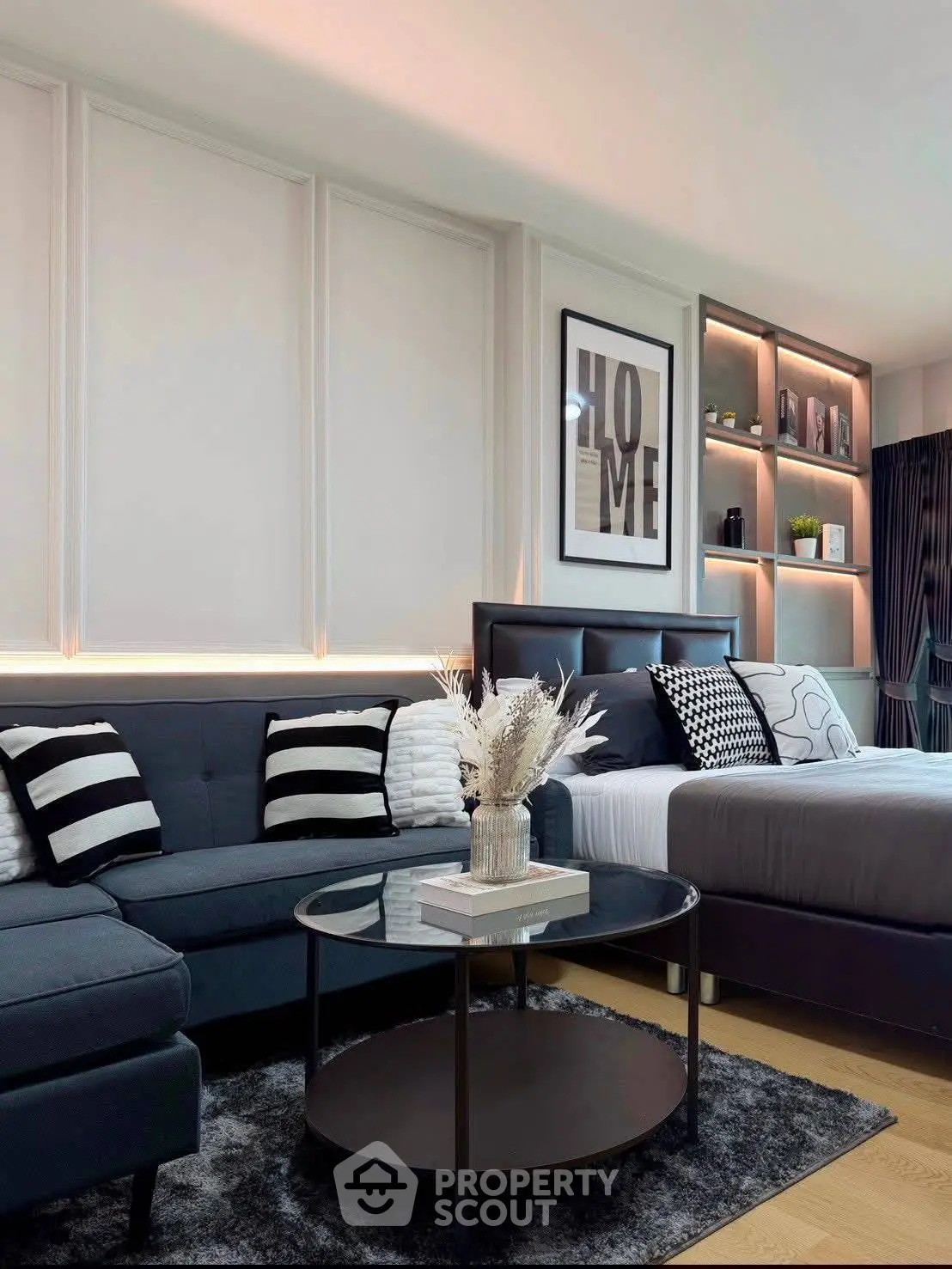 Modern living room with stylish decor and cozy ambiance, featuring a plush sofa and elegant furnishings.
