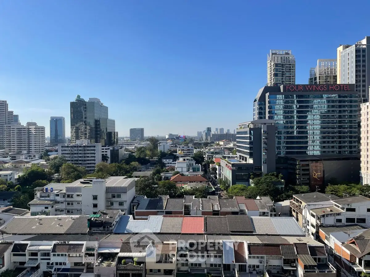 Stunning cityscape view from high-rise building in vibrant urban area.