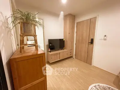 Cozy living room with modern wooden furniture and TV setup