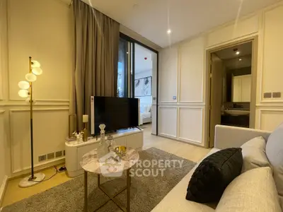 Elegant living room with modern decor and cozy ambiance in a stylish apartment.