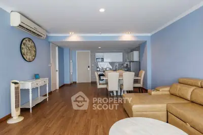 Spacious living room with modern furniture and open kitchen layout