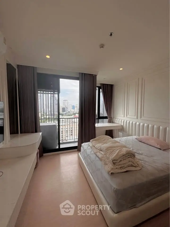 Luxurious bedroom with city view and elegant decor in modern apartment