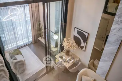Modern duplex apartment with stylish living room and dining area, featuring floor-to-ceiling windows and chic decor.