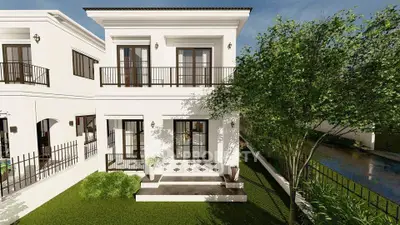 Elegant two-story white house with lush garden and balcony, perfect for modern family living.