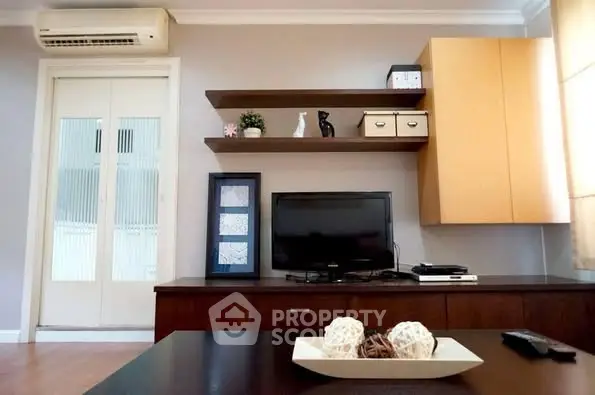 Modern living room with stylish shelving and entertainment center