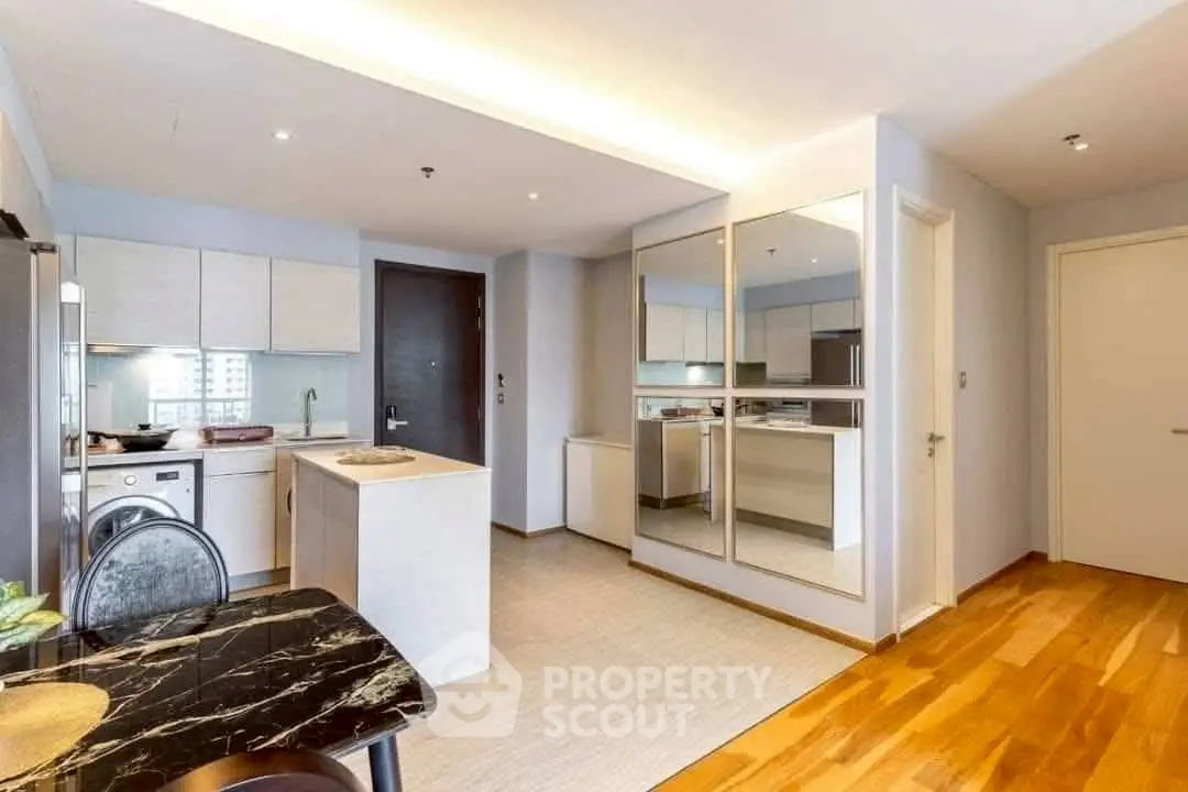 Modern kitchen with sleek design and open layout in a stylish apartment.