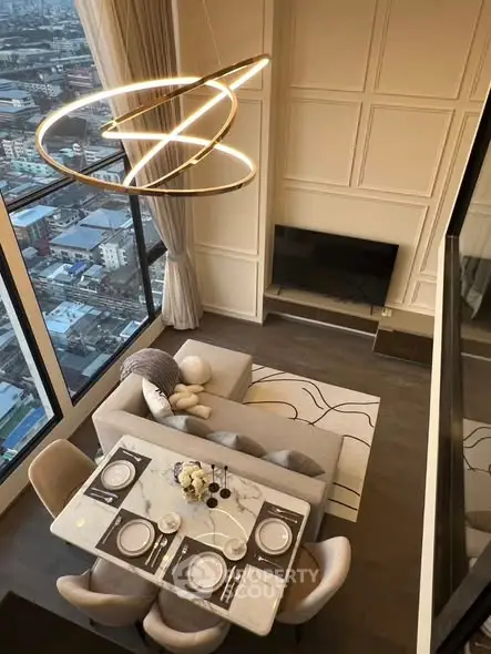 Luxurious high-rise living room with stunning city view and modern decor.