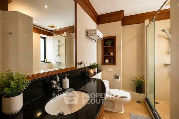 Luxurious bathroom with elegant fixtures and spacious shower area