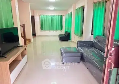 Spacious living room with modern furniture and large windows