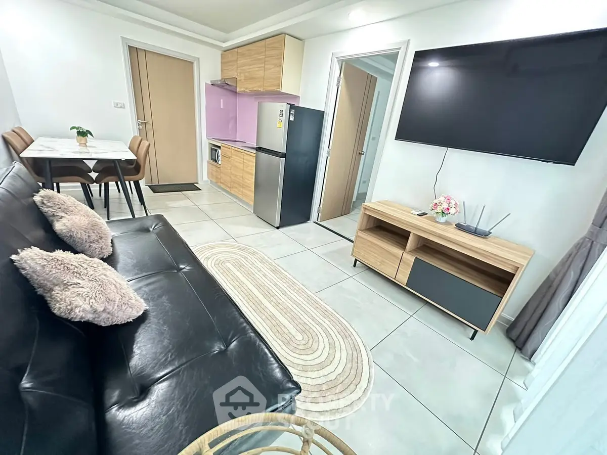 Modern living room with sleek furniture and open kitchen layout