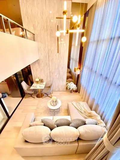 Luxurious high-ceiling living room with elegant decor and modern lighting in a stylish apartment.