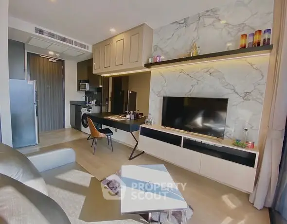 Modern living room with marble accent wall and sleek furniture