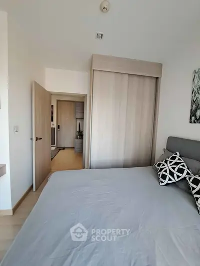 Modern bedroom with stylish decor and spacious layout in a contemporary apartment.