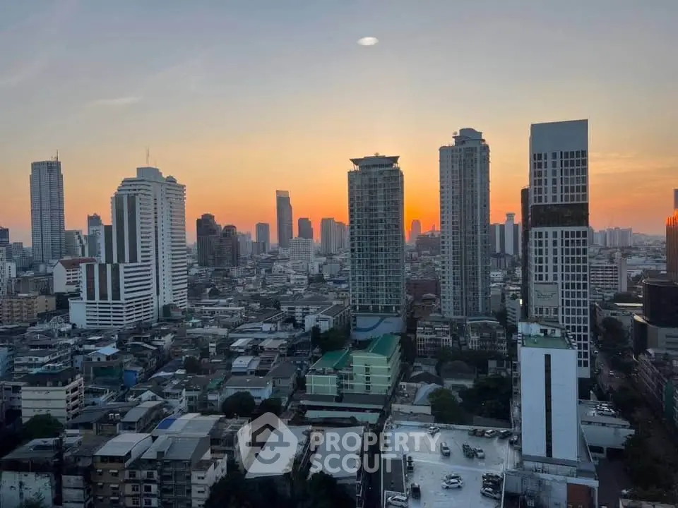 Stunning cityscape view from high-rise building at sunset, showcasing urban skyline and vibrant city life.
