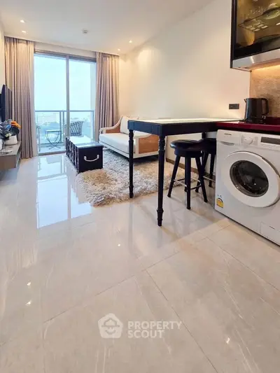 Modern living room with washing machine and balcony view in a stylish apartment.