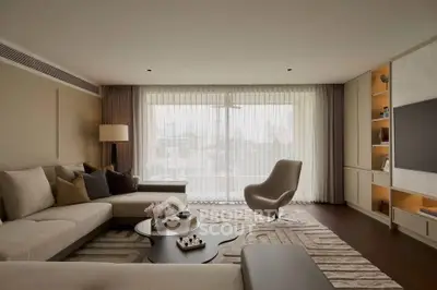 Luxurious living room with modern furniture and large window view.
