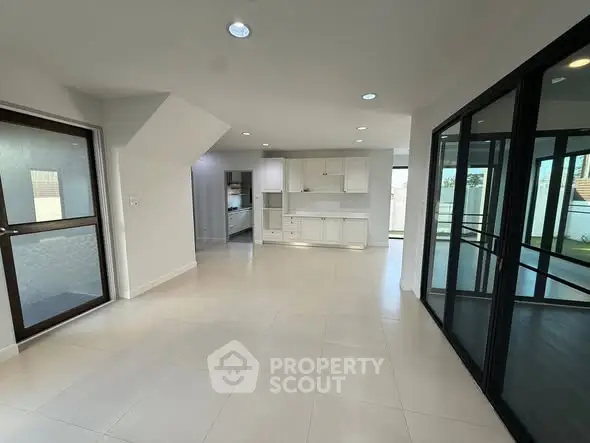 Spacious modern interior with sleek design and large windows for natural light.