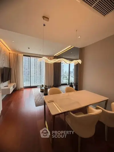 Luxurious modern living room with elegant dining area and stunning city view.