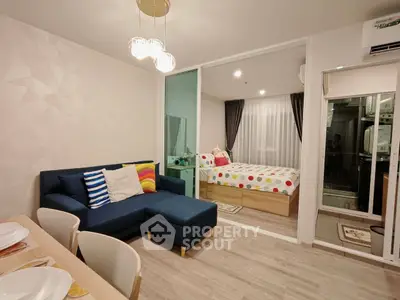 Modern studio apartment with stylish living area and cozy bedroom, featuring vibrant decor and open layout.