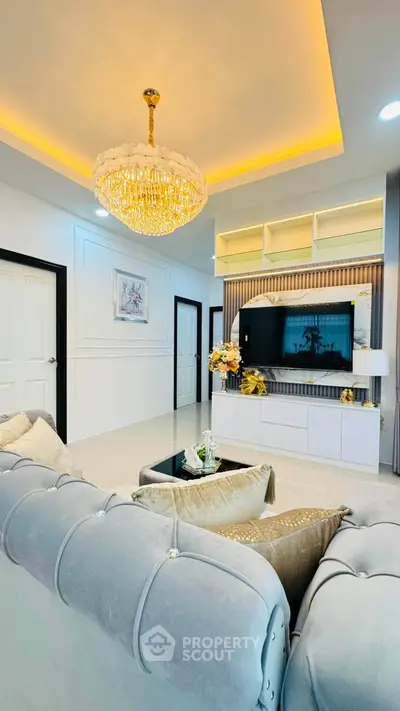 Luxurious living room with elegant chandelier and modern decor
