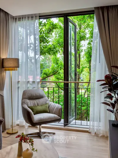 Modern living room with balcony view and lush greenery