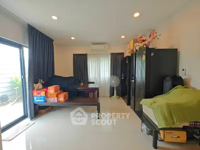 Spacious living room with modern decor and large windows for natural light