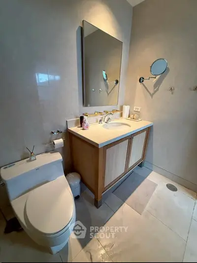 Modern bathroom with sleek fixtures and elegant vanity in a contemporary home.