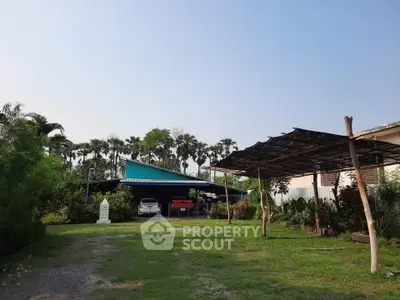 Charming rural property with lush greenery and spacious outdoor area, perfect for nature lovers.