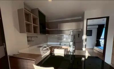 Modern kitchen with sleek design and open layout, featuring built-in appliances and ample storage space.