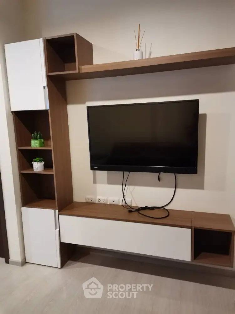 Modern living room with sleek TV unit and stylish shelving