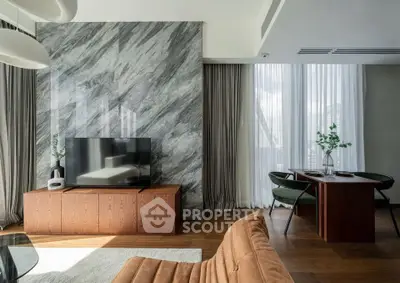 Luxurious modern living room with elegant marble accent wall and stylish furniture