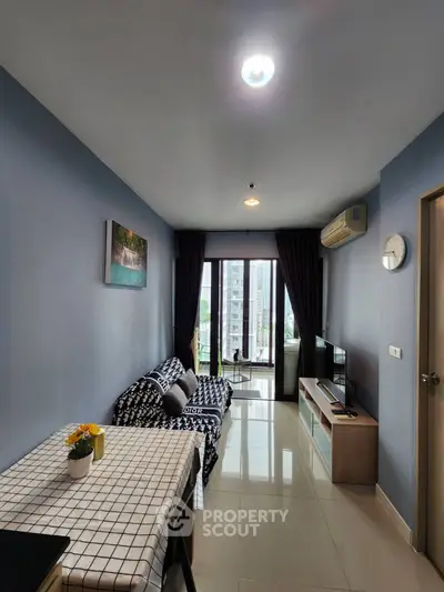 Modern living room with stylish decor and city view, perfect for urban living.