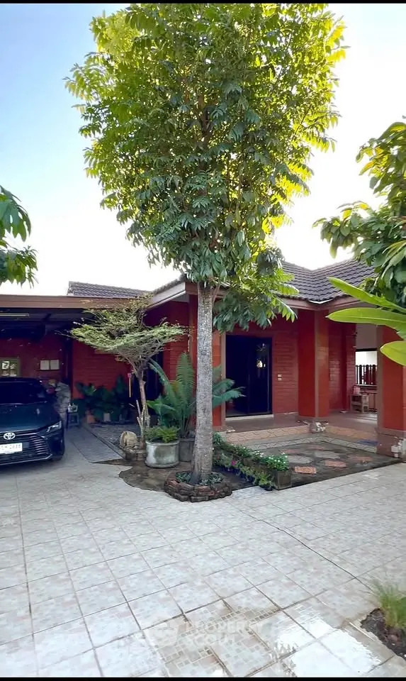 Charming brick house with lush garden and spacious driveway